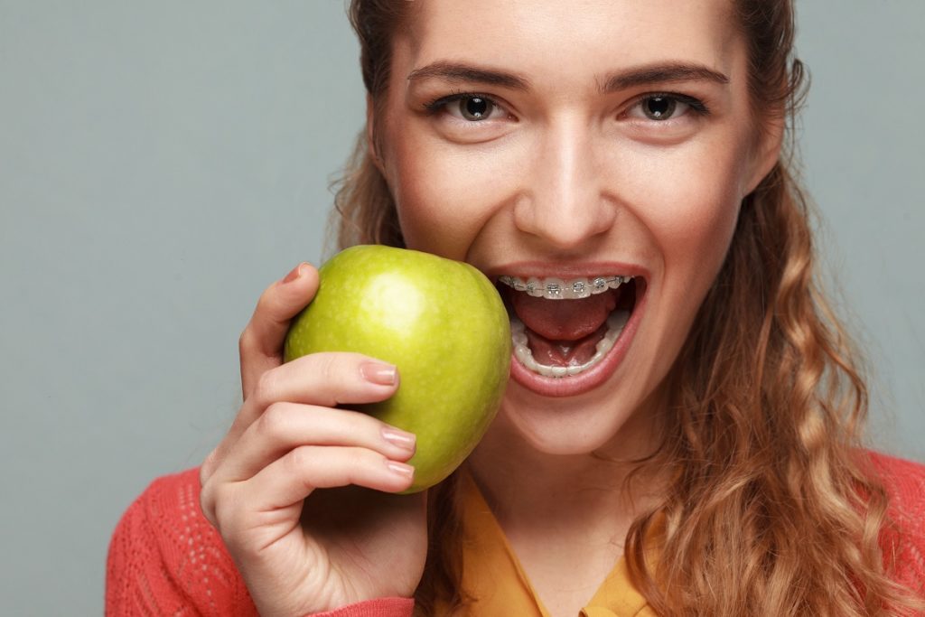 Woman biting an apple