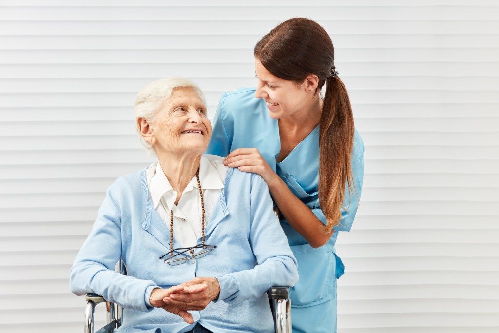 Elderly woman looking at a caregiver