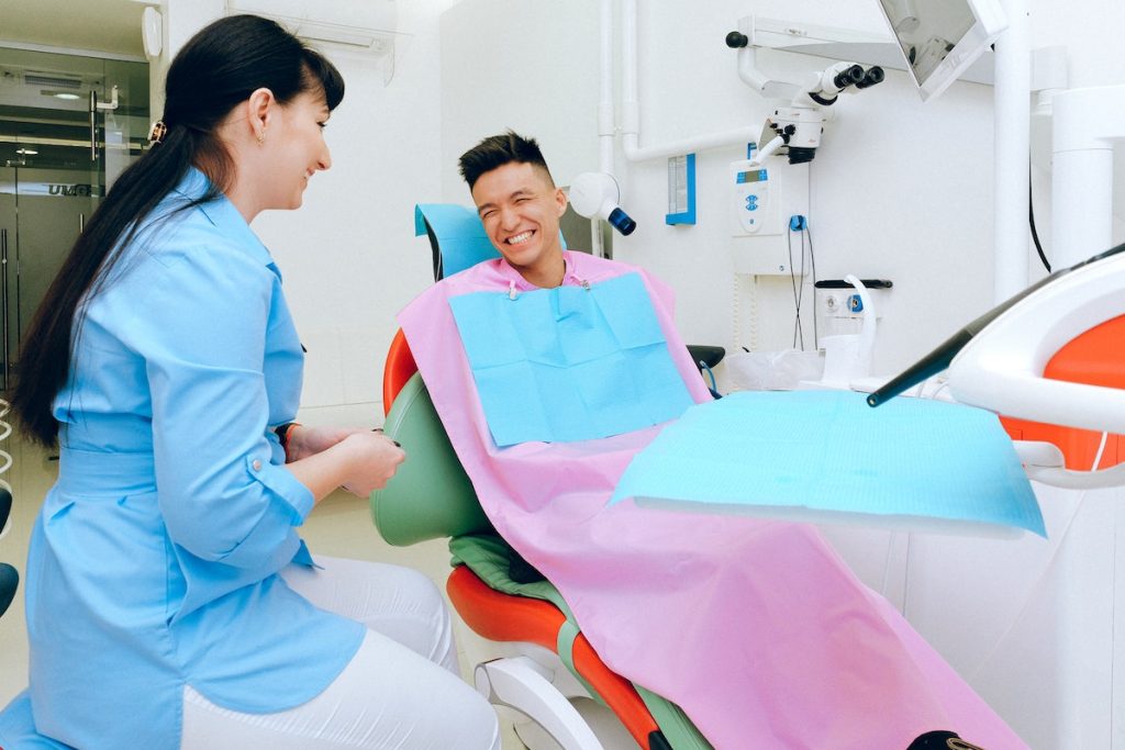 smiling man with her dentist
